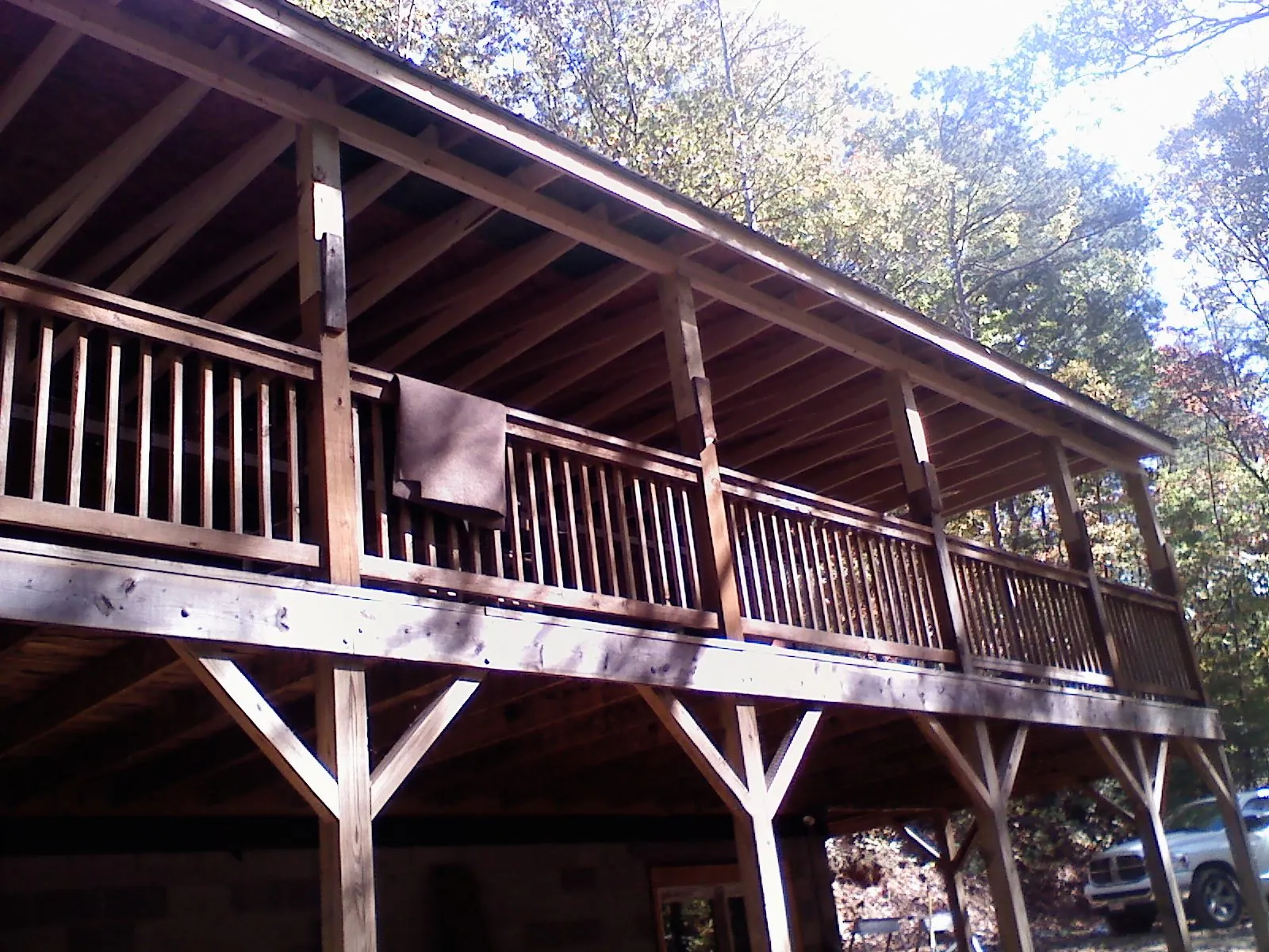 Timber framing under a new elevated porch and deck — Roof Leak Repair in Olsburg by Roofing Brothers